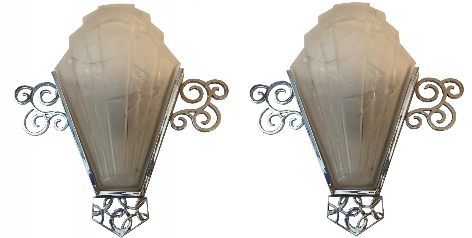 Antique pair of sconces with decorative chrome design