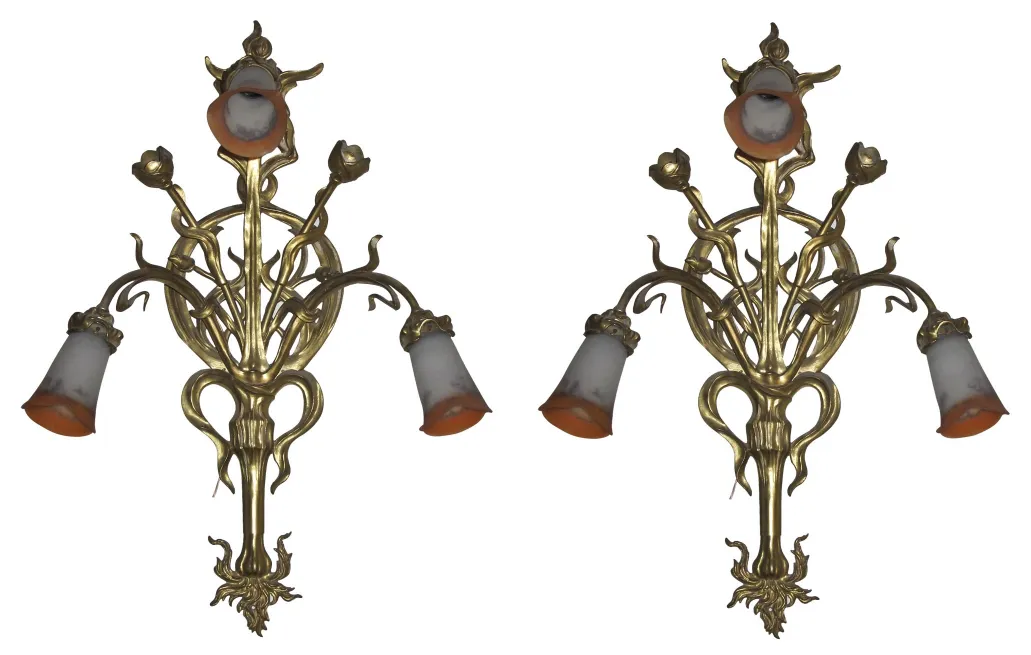 pair of antique sconces with floral design in elegant settings