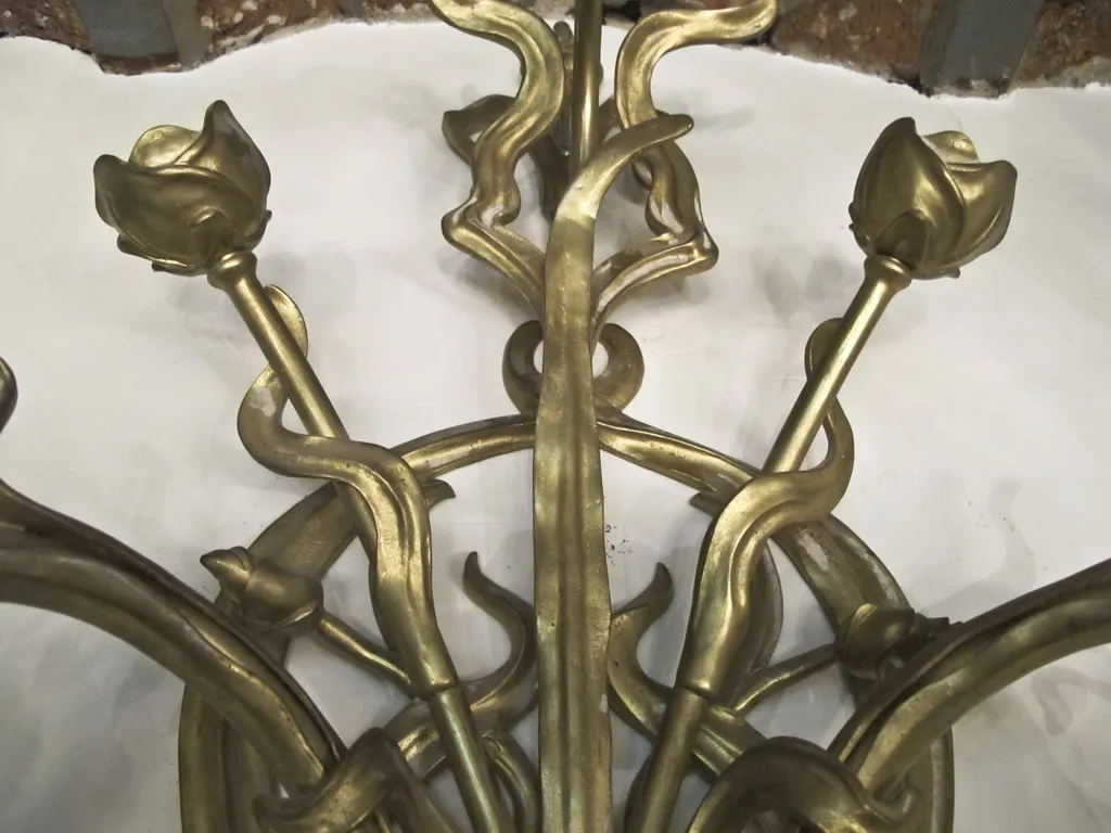 antique pair of sconces with floral designs