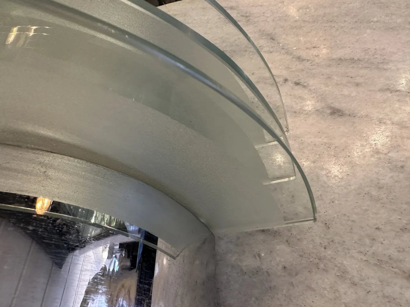 Antique sconce with curved glass design