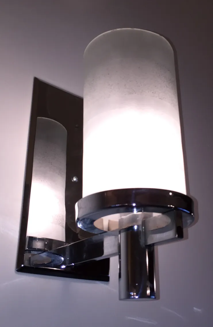 antique wall sconces brightening a modern space