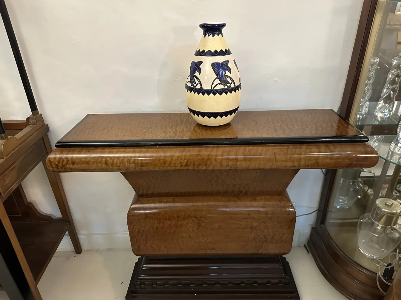 Decorative antique ceramic vase on wooden table