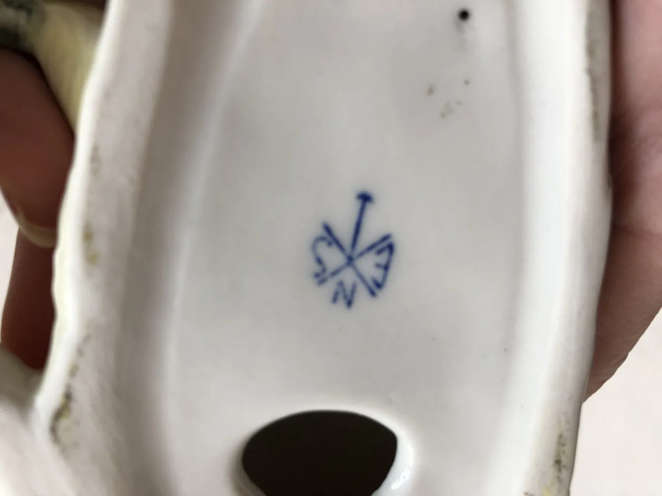 Antique ceramic with an artisan imprint on the base.