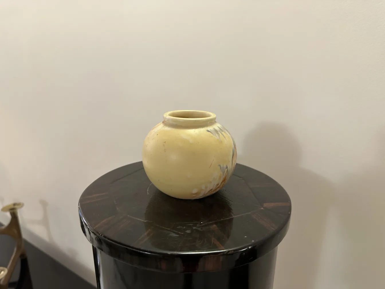 Antique yellow ceramic vase with subtle details