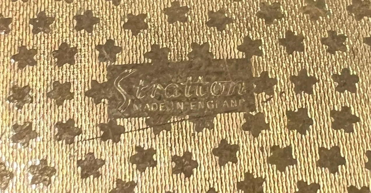 Ancien sceau stratton avec design distinctif et fond élaboré