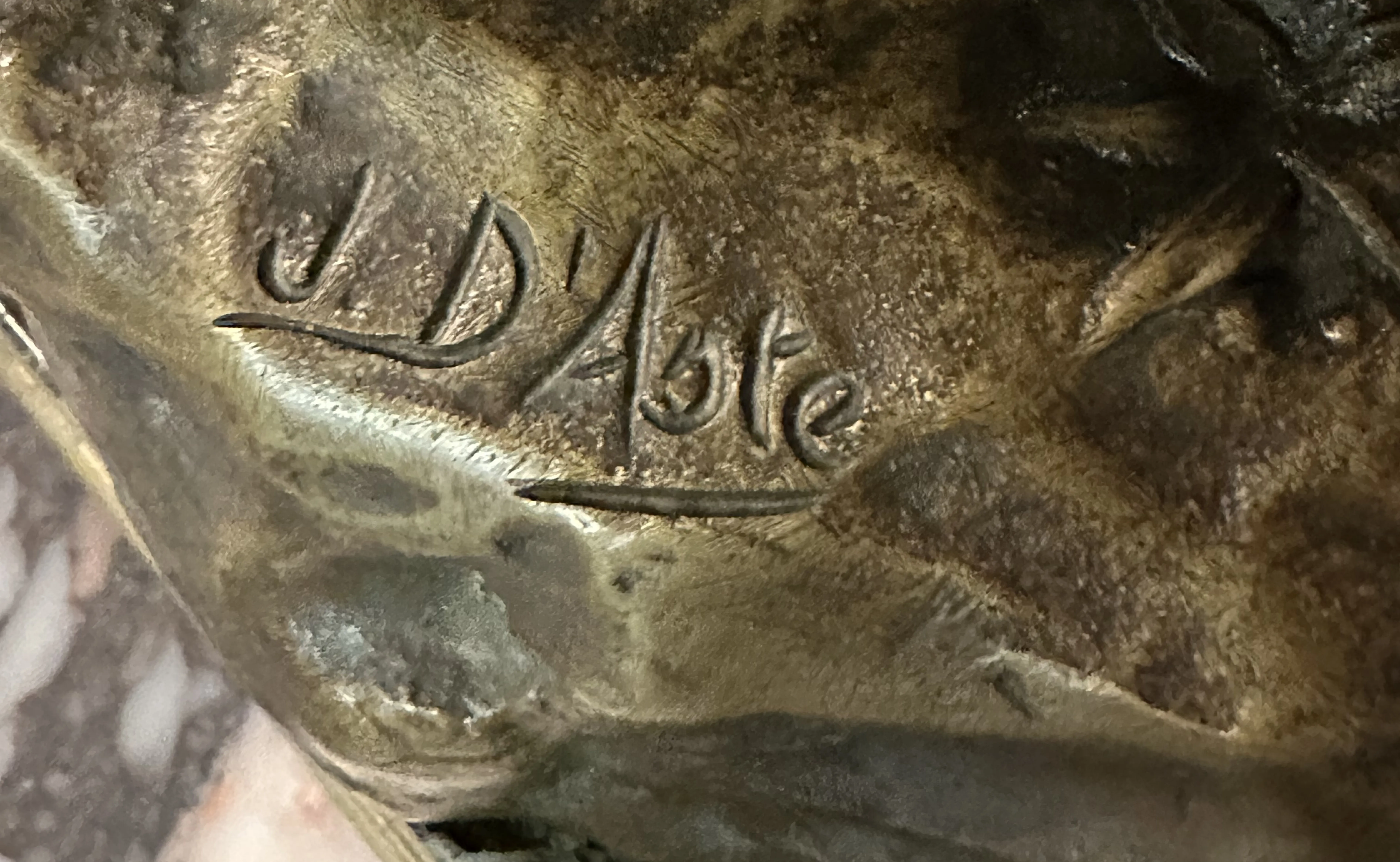 sigillo antico con firma J. D. Aste, formato distintivo, sfondo neutro.