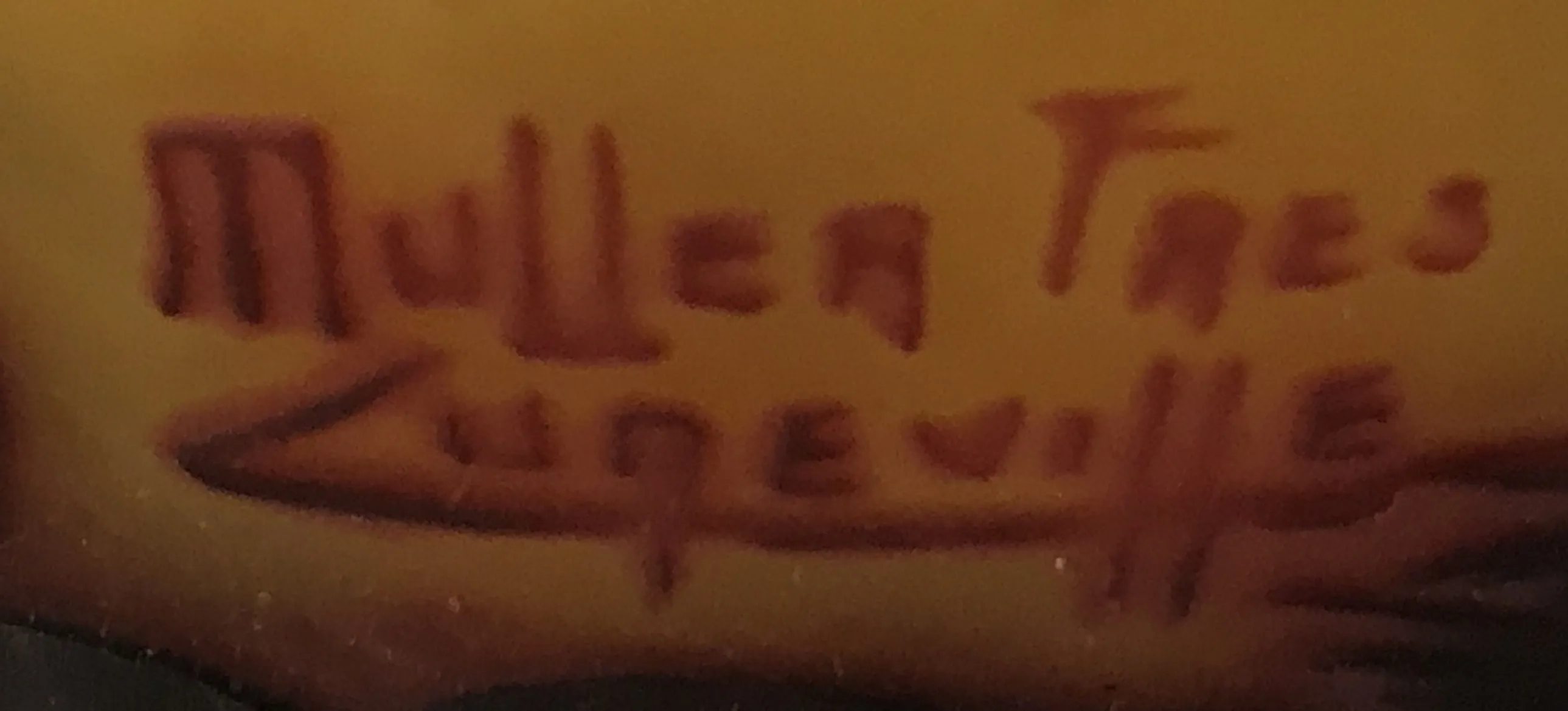 ختم قديم يحمل اسم muller fres luneville في الخلفية